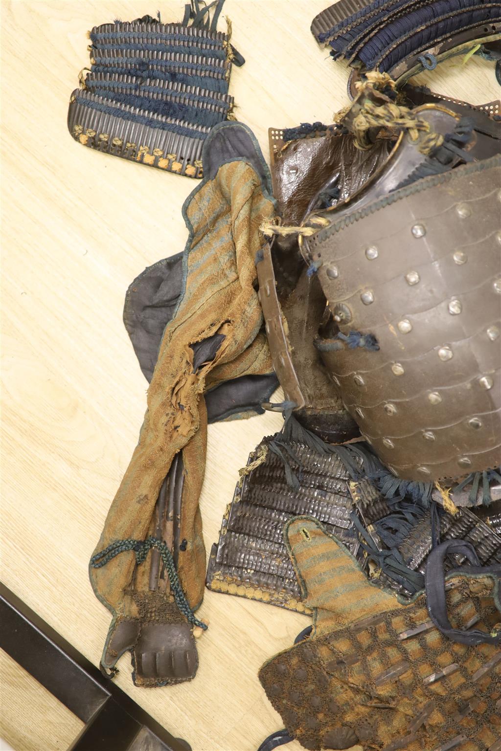 A Japanese iron armour Okegawa-do (Yoko-Hagi-horizontal make) 17th or 18th century, iron laminated breast and back plates with